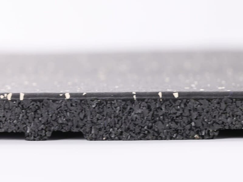 Professional commercial gym installation featuring high-density vulcanized rubber flooring